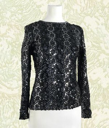 Glowing black and silver evening top