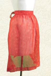 Red organdy apron with gold print