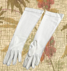 Sleek white gloves with black stitching