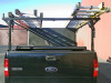 Extra wide configuration stake pocket ladder rack with straight legs shown (ladders, tie down straps and folding tonneau cover NOT included)