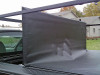 Extra wide configuration stake pocket ladder rack shown working with sectional tonneau covers