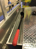 Westin Brute FlatbedSafe Heavy Duty Roller Drawer Truck Tool Box has a mesh aluminum tool tray integrated at the cab end for shovels and longer tools.  The mesh allows water to drain away easily.