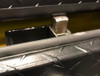 Westin Brute FlatbedSafe Heavy Duty Roller Drawer Truck Tool Box has a safety plunger latch that pops up when you unlock and open the drawer and drops down automatically when you close and lock the drawer, keeping your fingers and hands safe. Shown on a box with optional texture black powder coating.