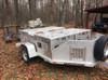 Creative design one of our customers did with our aluminum dog box doors and our sliding vents.  This is for a visual.  The trailer and boxes are not for sale.