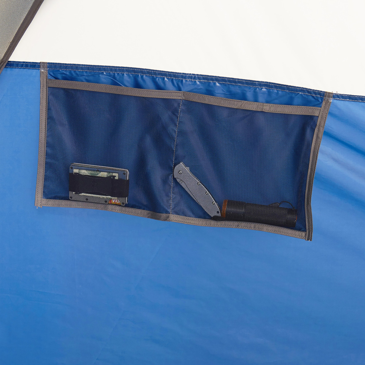 Interior of Wenzel Pinyon 10 Person Dome Tent, blue/white, showing hanging accessory pocket