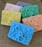 Octopus Bar soap in blue, orange, yellow, green, pink, purple and white.