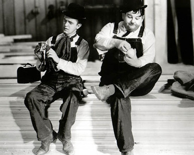Stan Laurel & Oliver Hardy in Busy Bodies (Laurel & Hardy) Poster and Photo