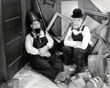 Stan Laurel & Oliver Hardy in Busy Bodies (Laurel & Hardy) Poster and Photo