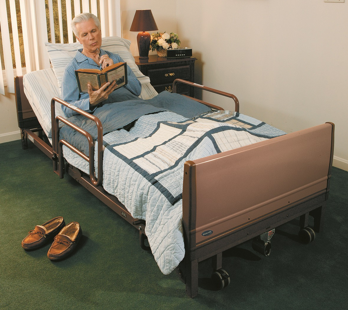 invacare 5410low full electric low hospital bed with over bed light nursing home