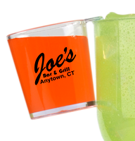 2oz Plastic Hook Shot hanging on the side of a large cup with a custom logo