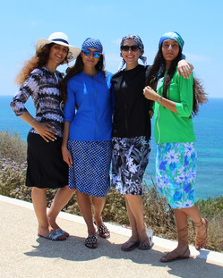 Models wearing style 2623 swim tops and style 2622 swim skirts
