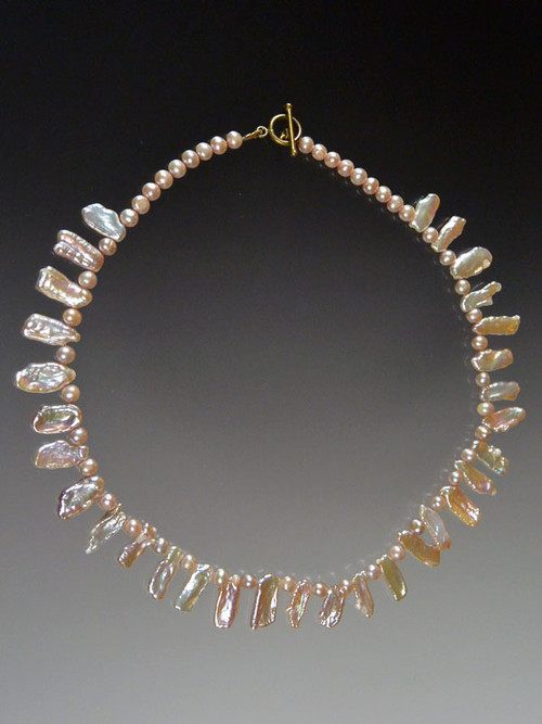This delicate gleaming collar is perfect for any age - truly luminous pink biwa pearls separated by tiny round pearls.  Clasp will vary but all equally beautiful. 18"