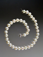 If you crave Mikimoto pearls but can't afford to walk in the door, these pearls are extraordinary for the price.  Totally classic silk-hand-knotted extremely well matched 14mm round white pearls with a white gold clasp.  17-1/2"