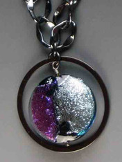 Dichroic disc blue, purple closeup