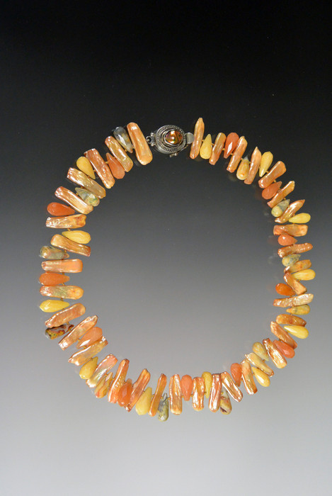 This colorful hand-knotted silk necklace features peach biwa pearls and jasper teardrops.  Choose 18" single strand or 20" double strand.