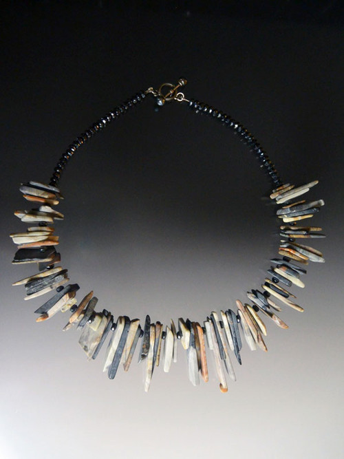 This unique necklace with a strong global vibe goes with everything and features multi tones of matte gray and pale apricot toned apricot shards.  Only 2.  20"