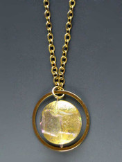 Make a dramatic statement with this dichroic* Venetian glass disc pendant with sparks of petal, silver and gold) suspended from a 24K ultraplate hoop (2") and looped chain 30"  