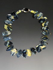 It is extraordinarily rare to find naturally occurring yellow and black opal in the same strain.  Years ago I bought this strand of amazing two toned opal in large faceted nuggets. This season I made a super dramatic necklace with smaller yellow opal rondels mixed in and a large onyx sterling clasp. 20"

