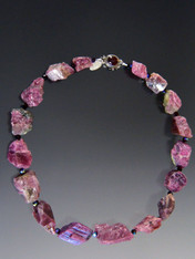 This fabulous necklace features irregular raw pink tourmaline in all its natural splendor with thick Japanese silk knots.  Dress it up or down and wear it anytime anywhere.  20"