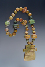 Fabulous green jade pendant necklace featuring faceted opal, jasper, and vintage bakelite.



