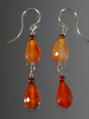Striking dangle earrings in top quality faceted carnelian citrine teardrops and sterling earwire.  Perfect match to necklace in the collection. 1.3/4"