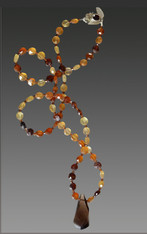 This spectacular faceted hessionite garnet rope in tones of wine, sienna, and pale citrine spaced with faceted garnet and finished off with a huge smokey topax swirl pendant will be the most versatile item in your wardrope.  Wear it alone, pair it with shorter pieces or ropes.  28" Topaz Swirl 1.5"

