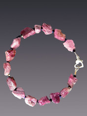 Mix this stunning natural pink tourmaline faceted garnet bracelet with others for a dramatic stacked look.  Sterling clasp. 7.5".