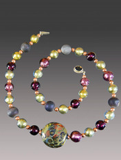 About 10 years ago a friend  on a trip to Venice brought me several extraordinary richly patterned Venetian beads in a a shape I've never seen again. This particular one of a kind bead features splashes of rich copper and is the highlight of a shorter version of my purple druzy Venetian amethyst olive copper rope with a garnet clasp..  Absolutely gorgeous and only one!  