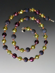 This new design in a few choices is my favorite new combo.  It features a medley of beautiful round beads - genuine shiny copper, rich purple druzy, Venetian dark and light sterling silver foil amethyst, and light olive Goes with every color in your wardrobe and is perfect for now.  Wear it long or doubled for a dimensional effect as you wish 36.5"