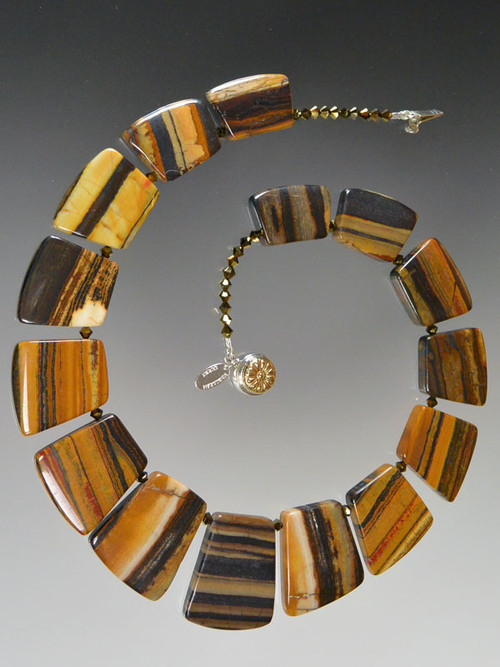 If you favor earth tones and interesting patterns, this versatile tiger iron jasper fitted geometric collar spaced with tiny complementary Swarovski crystals will go with everything in your wardrobe all year round. 18"

