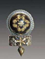 This is one of the most amazing Amy Kahn Russell designs I've ever seen.  This dramatic pin/pendant is more striking in person than in this picture.  It features a gorgeous antique collectible Czech glass button with a striking gold crest pattern and a rare Japanese metal kashira sword mounting carved with deeply dimensional gorgeous gold leaf completed with a carved gold agate leaf dangle.  3-1/2" x 2-1/2"