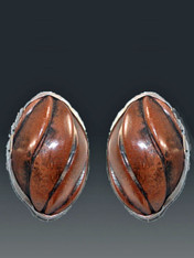 Ever wish you had elegant carved wood earrings to go with your casual tribal looks?  If the answer is yes,you'll love these gorgeous earrings. These Amy Kahn Russell earrings feature richly grained hand carved wood bezel set in a sterling silver frame.   1-1/4 ovals. Now clips; convert to posts for $15. 