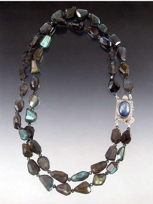 Understated dazzle is yours with two strands of rich blue sparkling labradorite nuggets sapphire Austrian crystals and a sterling kyanite clasp for a side or center highlight. 18"