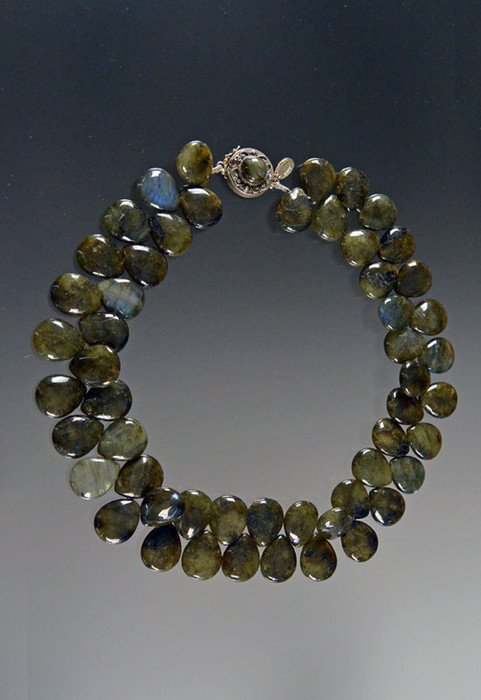 Enjoy this dimensional glittering collar of briliant labradorite teardrop florets shooting off sparks of blue, gray, green and other tones to pick up what you're wearing with a gorgeous custom labradorite sterling clasp.  19"
