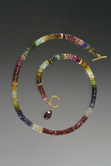 This elegant necklace features precious gemstones spaced with 14k fluted rondels.