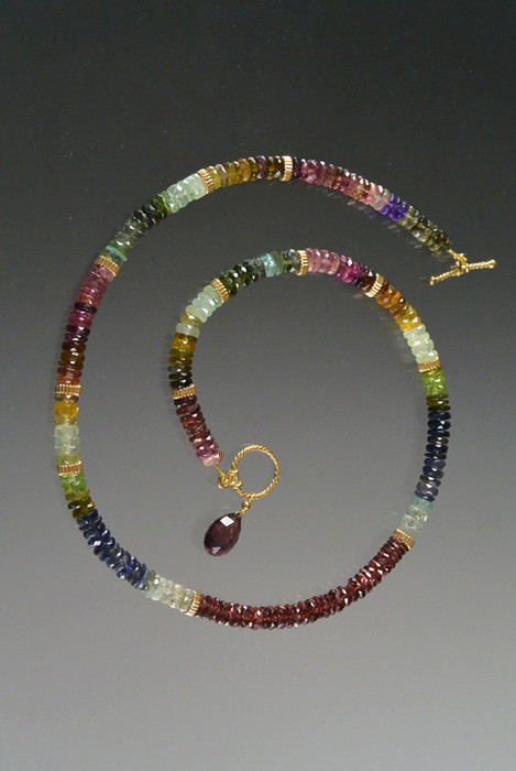 This elegant necklace features precious gemstones spaced with 14k fluted rondels.