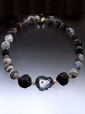  A dramatic collar of weathered agate balls with hammered tourmaline, two large Brazilian hammered onyx stones and a freeform weathered agate slice. 