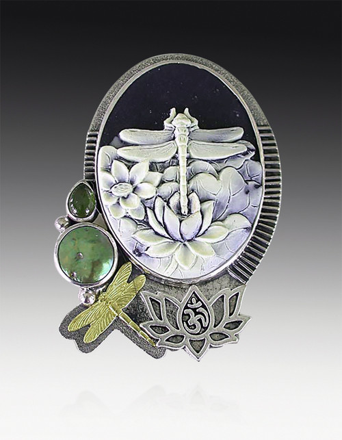 This delightful pin/pendant by Amy Kahn Russell is brand new and features a natural carved cameo set in an embellished silver frame with an elaborate natural leaf silver bottom, a freshwater pearl and green vesuvianite* and  freshwater pearl on the side.  Add any chain your heart desires.  2.25" x 1.5"
