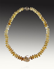  These luxurious shaded citrine German faceted rondelles have a stunning luster, superior polish and faceting that transforms each bead into brilliant transparent gems with hues ranging from pale yellow to a deep saturated Amber Yellow.  The center focal is a discontinued champagne faceted Swarovski disc with a citrine sterling clasp. 18" Only two!