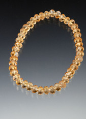 This sparkling stretch bracelet of faceted grade AA citrine rondels is perfect alone or paired with others.