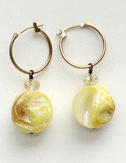 Carved Yellow Mother of Pearl round earrings on 14K hinged Hoops