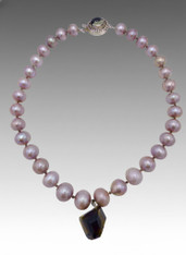 Large mauve pearls with a faceted smoky quartz pendant
