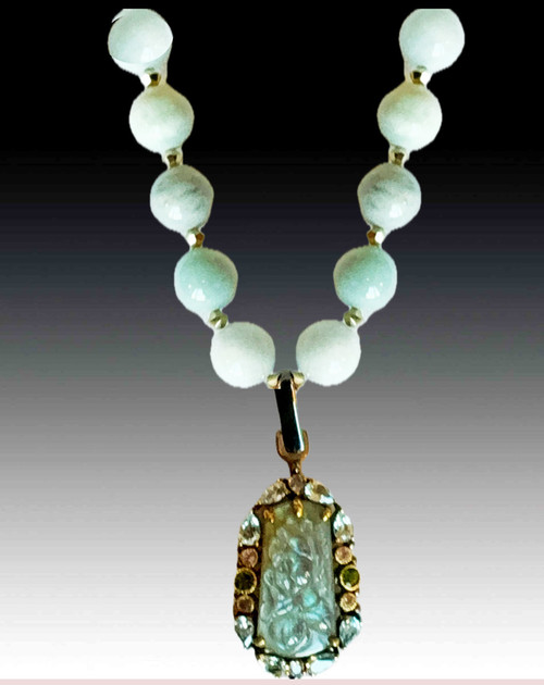 You'll make a statement with this stunning large Burmese Jade necklace with a hand carved 25ct labradorite pendant surrounded by precious jewels and 24K vermeil flowers.   18"
