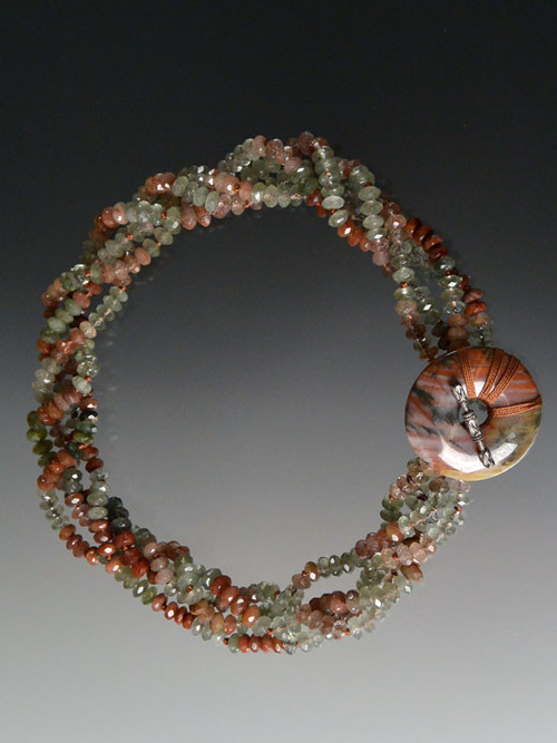 multi-toned rutilated quartz rondels with matching toggle clasp. Very rare