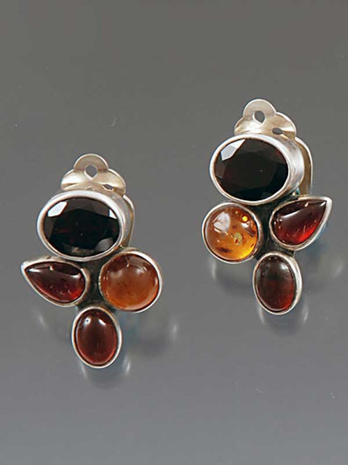 These Amy Kahn Russell earrings feature rich faceted garnet, amber and tourmaline cabochons bezel set in sterling silver. 1" x 3/4" 