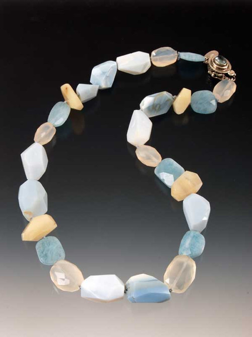 This delightful collage of Grade AAA Oregon and Peruvian opal, calcedony, and faceted aquamarine features a vintage Peruvian aquamarine sterling clasp.  19" 