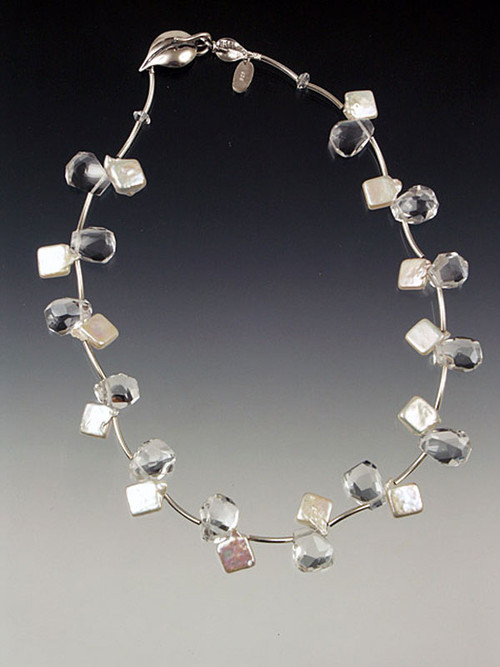 Light as a feather and so versatile! A cool collar of rock crystal and luminous white pearls spaced with sterling vines and held with a large sterling leaf clasp to be worn side, center or back. 17" Also available in 18" and 19"