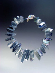 A website best buy with amazing impact!  An 18" collar of iridescent natural quartz with tones of silver and pale blue with custom sterling clasp. Also available in 19.5"