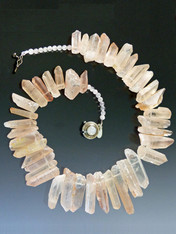 A website best buy with amazing impact!  An 18" collar of blush iridescent natural quartz with tones of silver and pale blue with custom sterling clasp. Also available in 19.5"