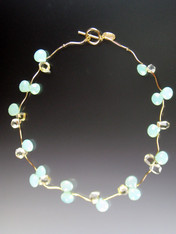 A bestseller and best buy!  Delicate flowers of luminous aqua chalcedony and pale citrine blossoms rest between 14K branches and clasp. 17-1/2"